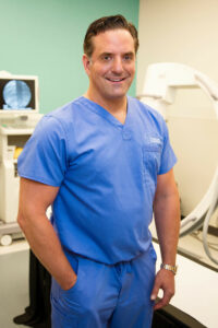 DR Nick Weber standing in medical room